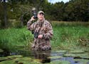 Duck stamp artist Mark Thone headed out to a nearby marsh in search of waterfowl and inspiration to document with camera Thursday, Oct. 5, 2017, in Sh