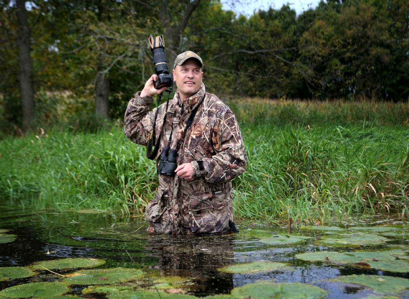 Duck stamp artist Mark Thone headed out to a nearby marsh in search of waterfowl and inspiration to document with camera Thursday, Oct. 5, 2017, in Shakopee, MN.] DAVID JOLES &#xef; david.joles@startribune.com We are following duck stamp artist Mark Thone into a marsh for a feature about what inspires his artwork. It recently won the Department of Natural Resources' state duck stamp contest.**Mark Thone,cq