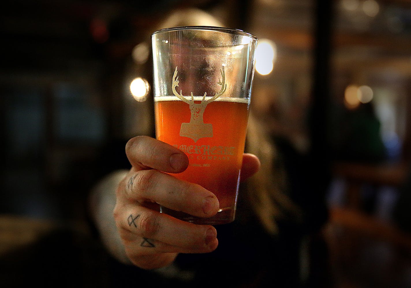 HammerHeart Brewing Company co-founder Austin Lunn displayed a beer called Bade Tiss. ] (JIM GEHRZ/STAR TRIBUNE) / August 10, 2013, Lino Lakes, MN &#x201a;&#xc4;&#xec; BACKGROUND INFORMATION- The HammerHeart Brewing Company opened recently in Lino Lakes. According to its two founders, the brewery is built in the honor and recognition of the old Nordic and Celtic cultures.