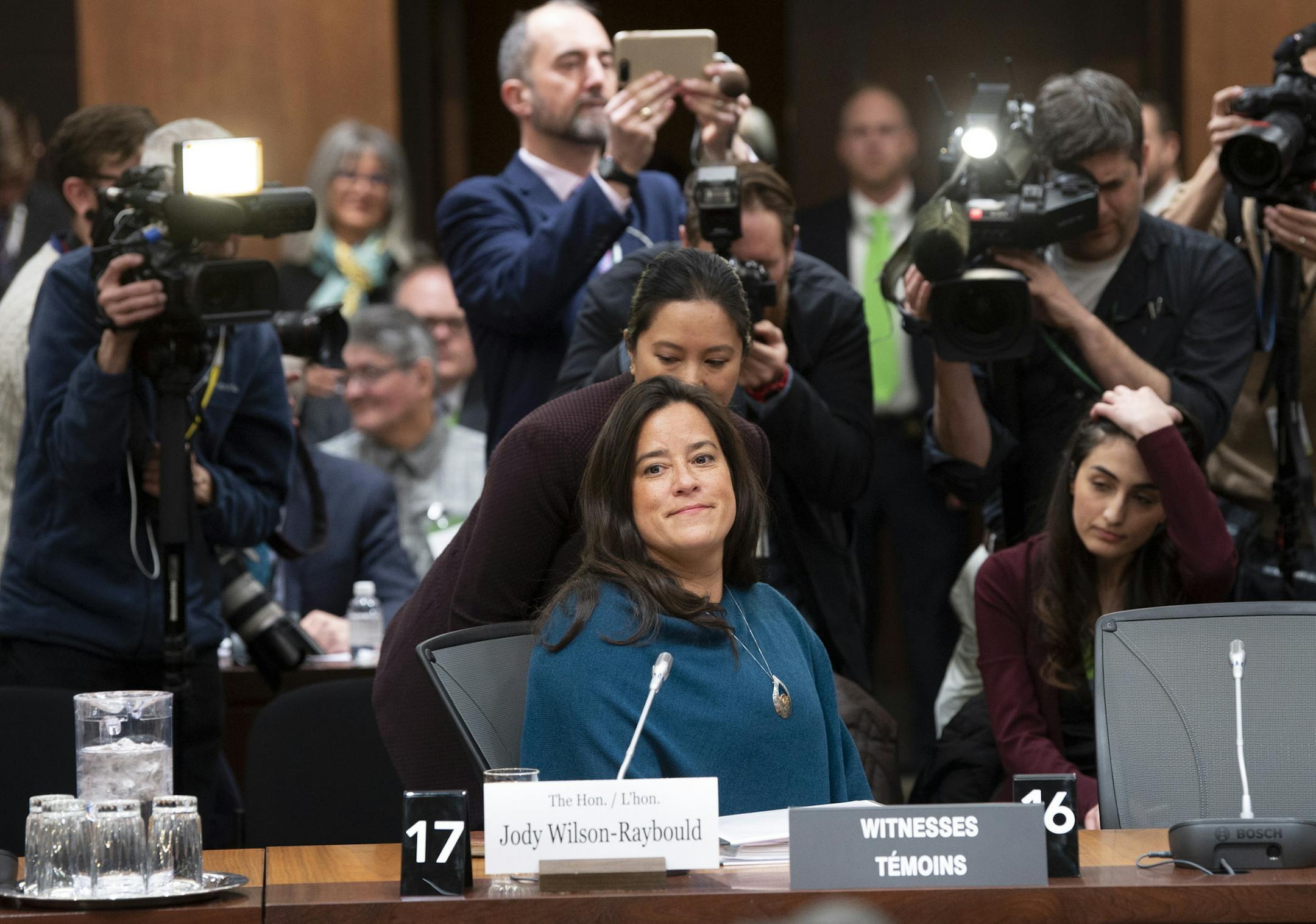 Cameras follow Jody Wilson Raybould as she waits to appear in front of the Justice committee in Ottawa, Wednesday February 27, 2019. Wilson Raybould is testifying she experienced a consistent and sustained effort by many people in Prime Minister Justin Trudeau's government to inappropriately interfere in the prosecution of a major Canadian engineering company (Adrian Wyld/The Canadian Press via AP) ORG XMIT: AJW116