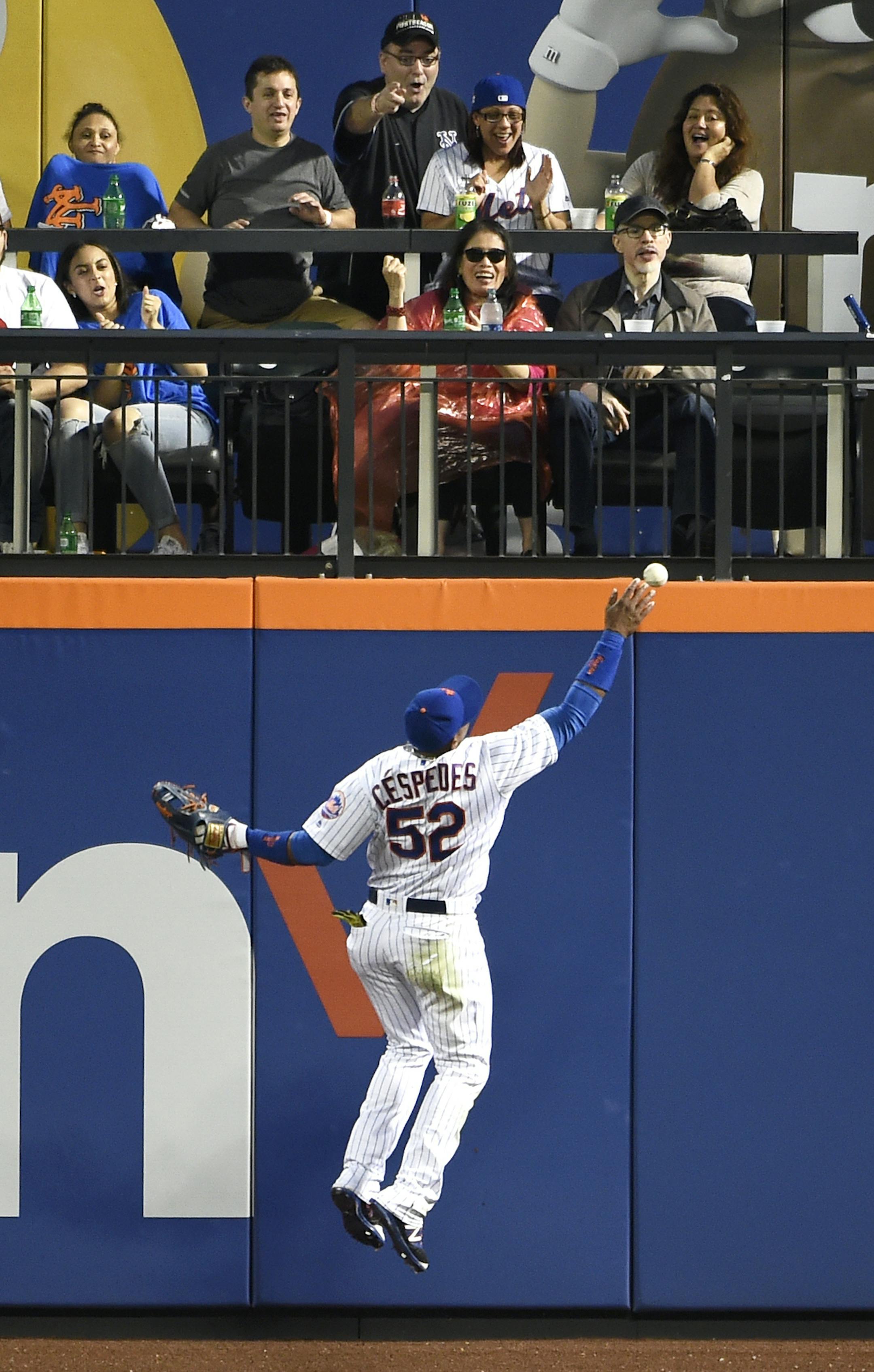 New York Mets center fielder Yoenis Cespedes is unable to reach a fly ball by Washington Nationals' Daniel Murphy in the third inning of a baseball game, Friday, July 8, 2016, in New York. (AP Photo/Kathy Kmonicek)