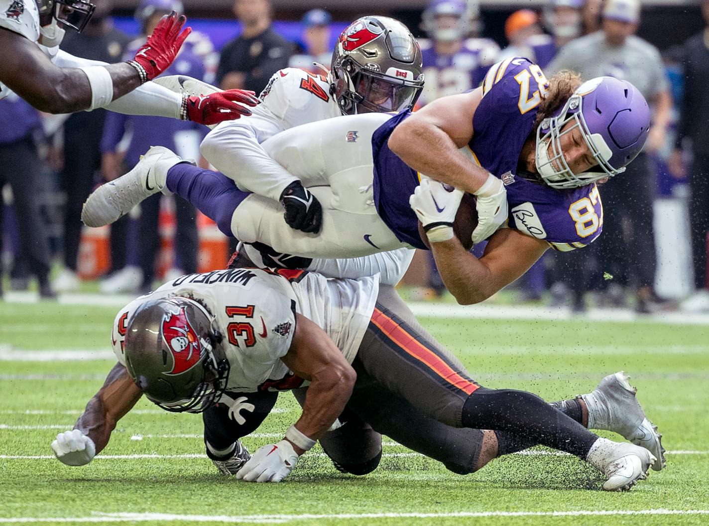 Minnesota Vikings tight end T.J. Hockenson (87) is tackled by Antoine Winfield Jr. (31) of the Tampa Bay Buccaneers in the third quarter Sunday, September 10, 2023, U.S. Bank Stadium in Minneapolis, Minn. ] CARLOS GONZALEZ • carlos.gonzalez@startribune.com