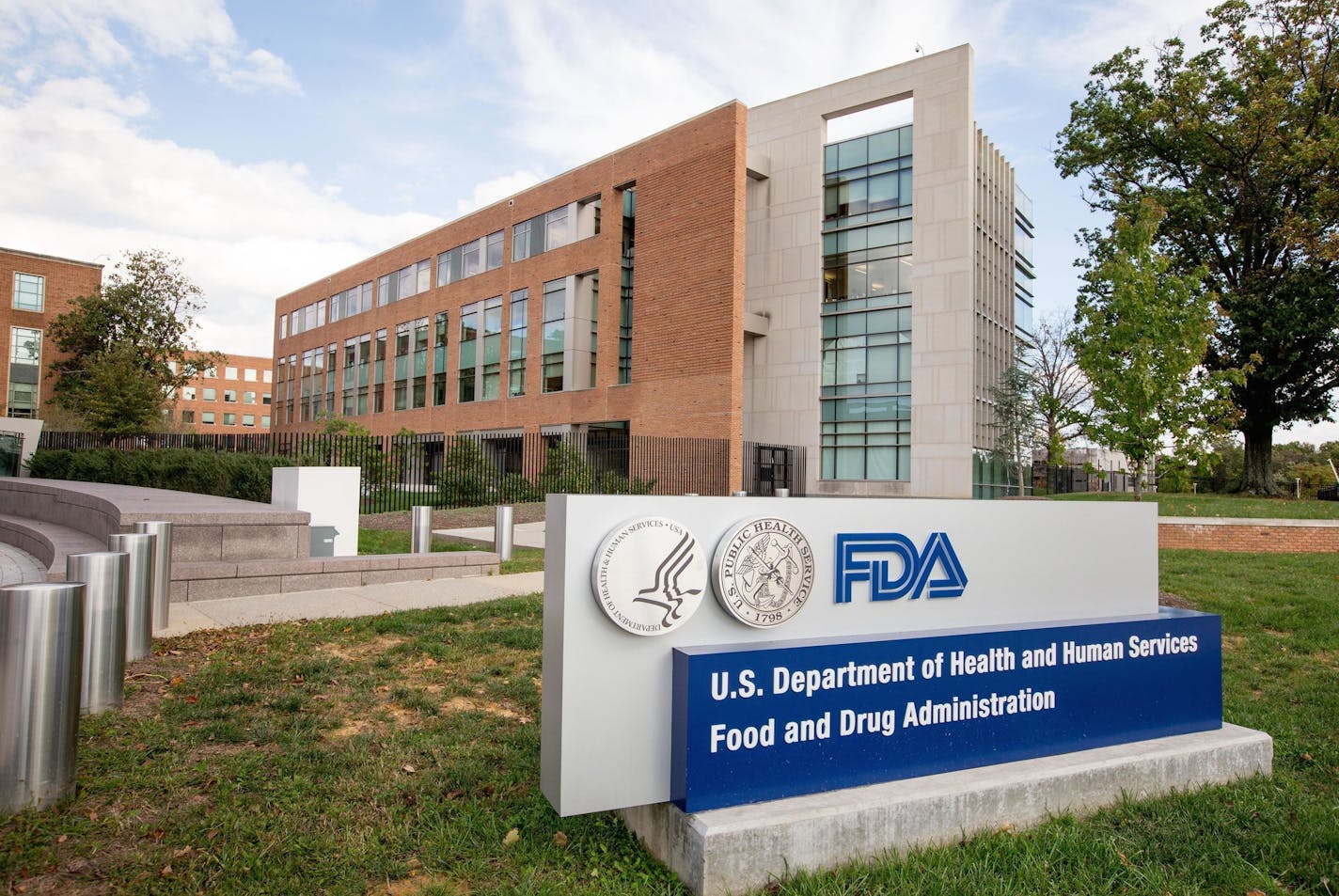 FILE - This Oct. 14, 2015, file photo shows the Food and Drug Administration campus in Silver Spring, Md. The FDA on Monday, Sept. 19, 2016, granted tentative approval to the first drug for muscular dystrophy, following an intense public campaign from patients and doctors who pushed for the largely unproven medication. The FDA cleared Sarepta Therapeutics&#xed; Exondys 51 for a rare form of Duchenne muscular dystrophy, a deadly inherited disease that affects boys. (AP Photo/Andrew Harnik, File)