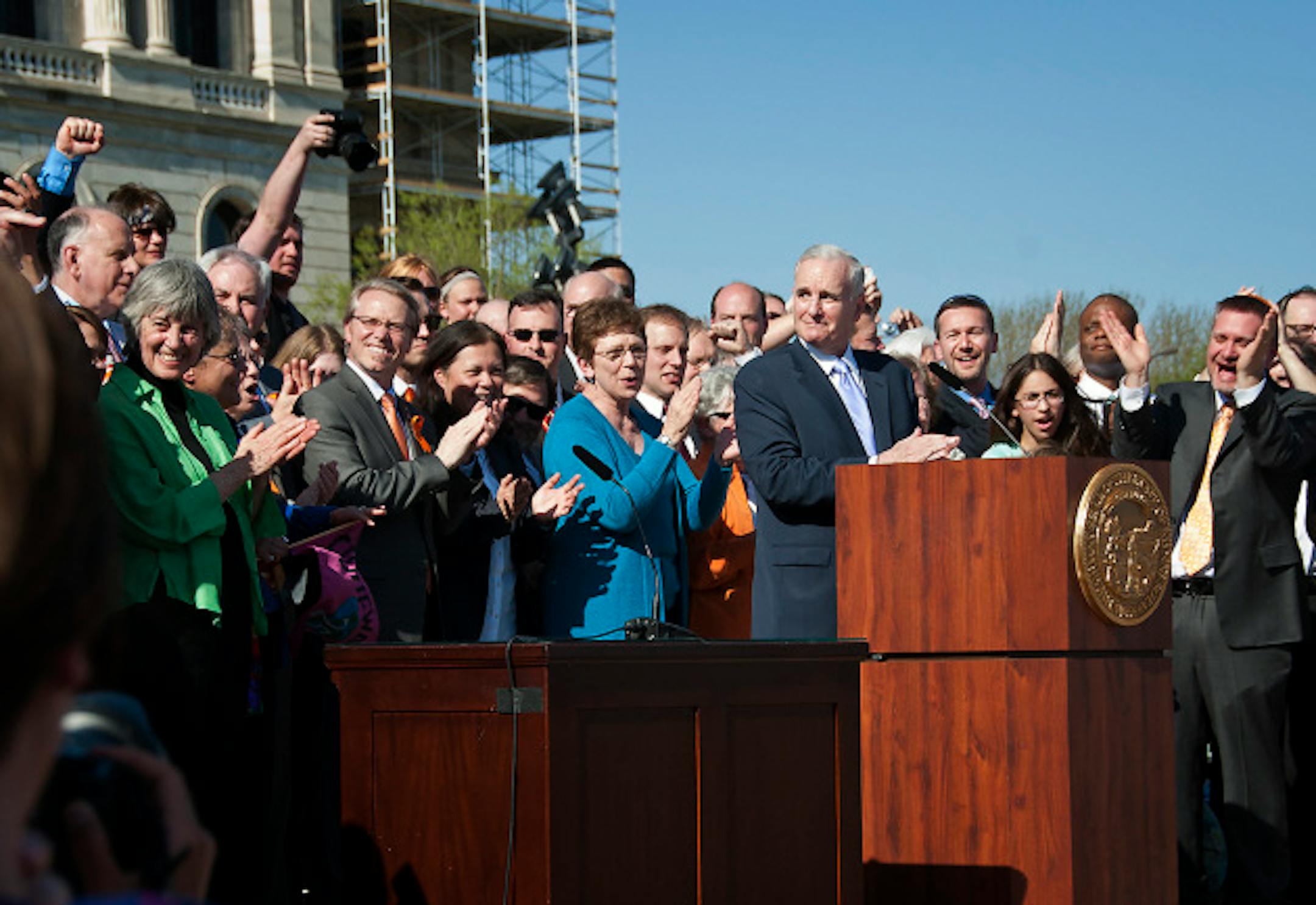 Governor Mark Dayton signed the marriage bill into law Tuesday, May 14, 2013  in front he the Capitol.  With him were bill authors  Senator Scott Dibble with husband Mark Leyva and Rep. Karen Clark with her partner Jacqueline Zita and all the legislators who voted yes.    ]   GLEN STUBBE * gstubbe@startribune.com