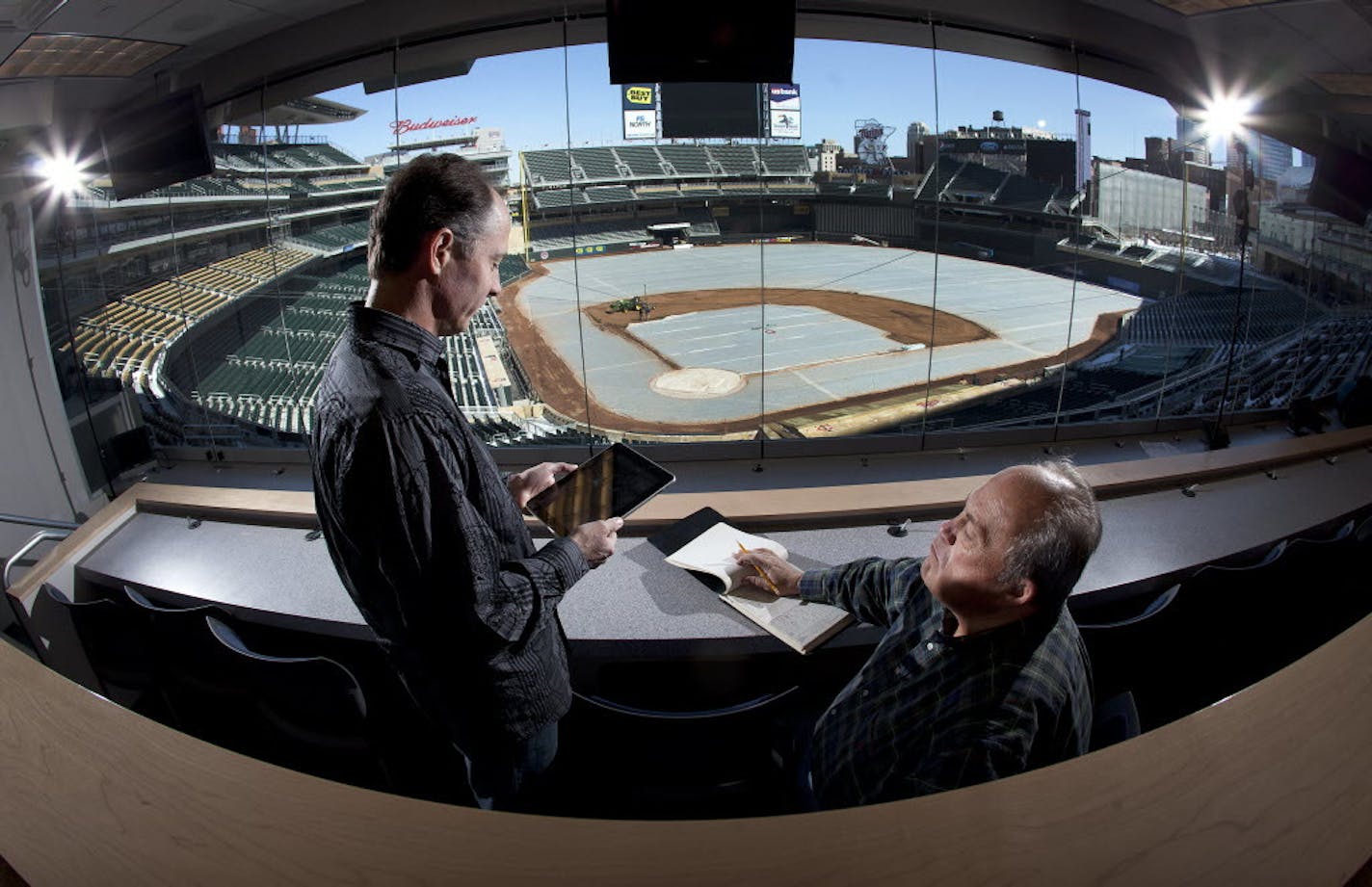 Jim Souhan (left) and Patrick Reusse, shown together in the Target Field press box a few years ago, have very different thoughts about the Twins' recent roster moves.