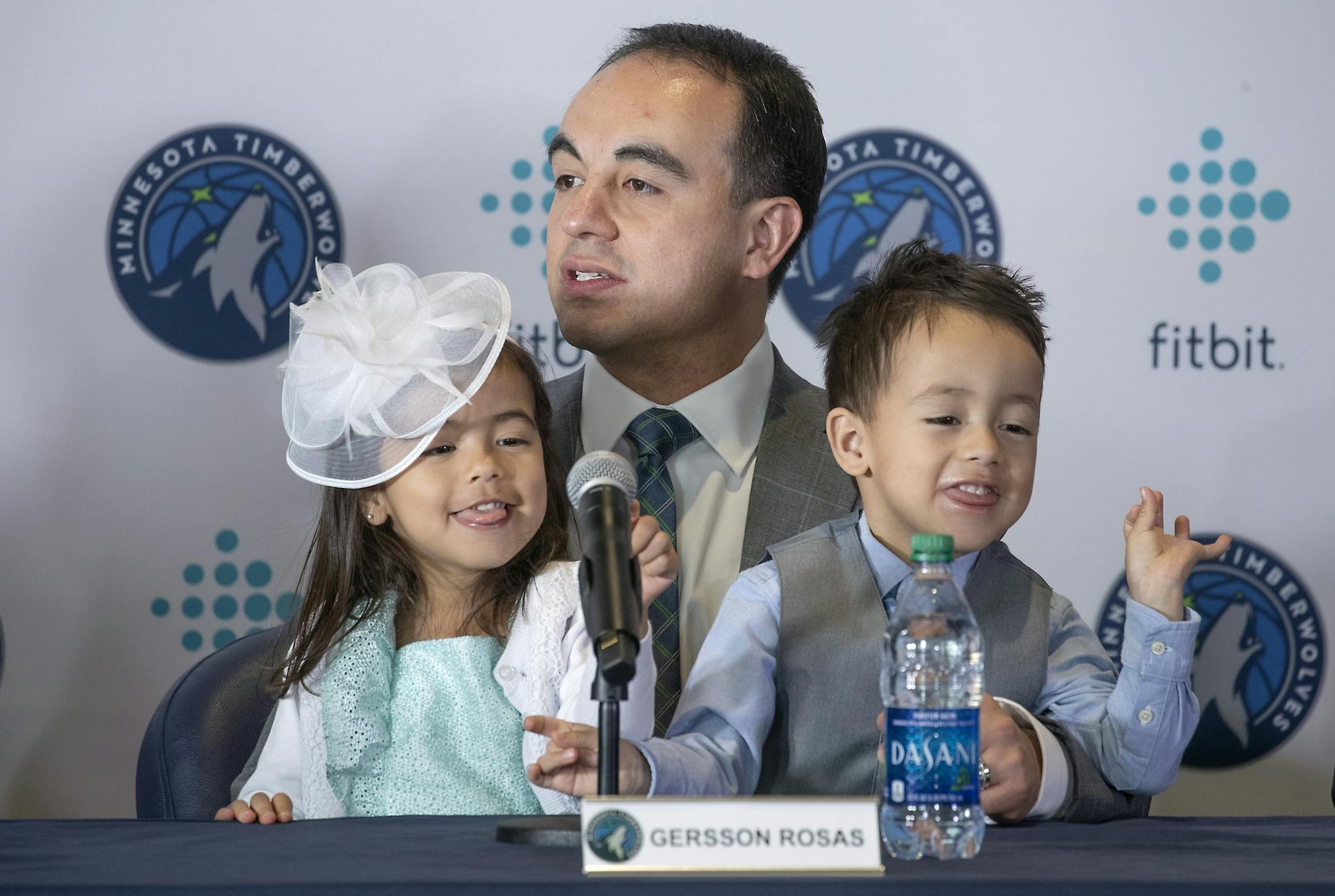 Minnesota Timberwolves new President of basketball operations Gersson Rosas addressed the media as his 3-year-old twins Giana, left, and Grayson sat on his lap during a press conference at the Target Center, Monday, May 6, 2019.