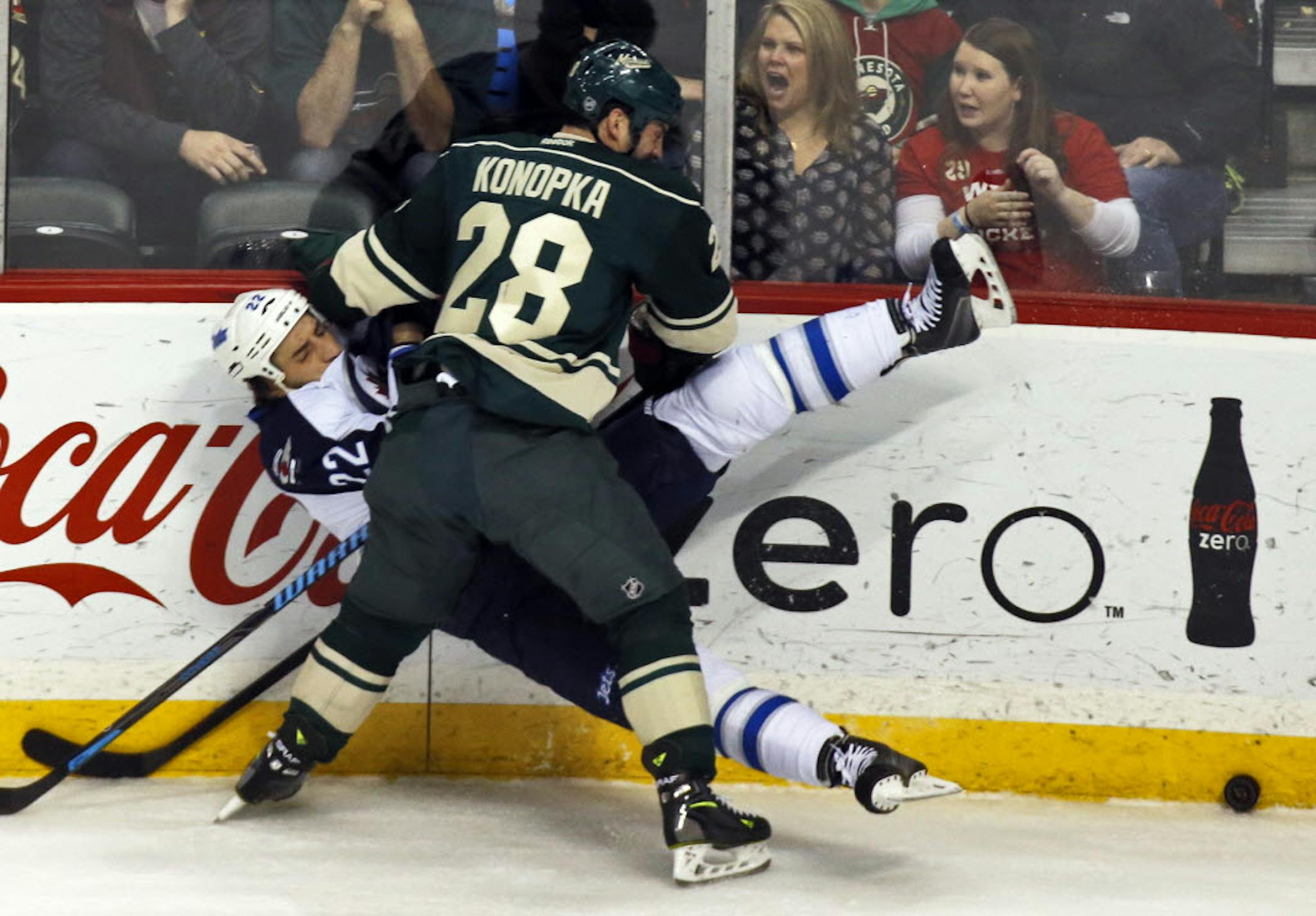 Minnesota's Zenon Konopka and Winnipeg's Chris Thorburn mixed it up in first-period action.