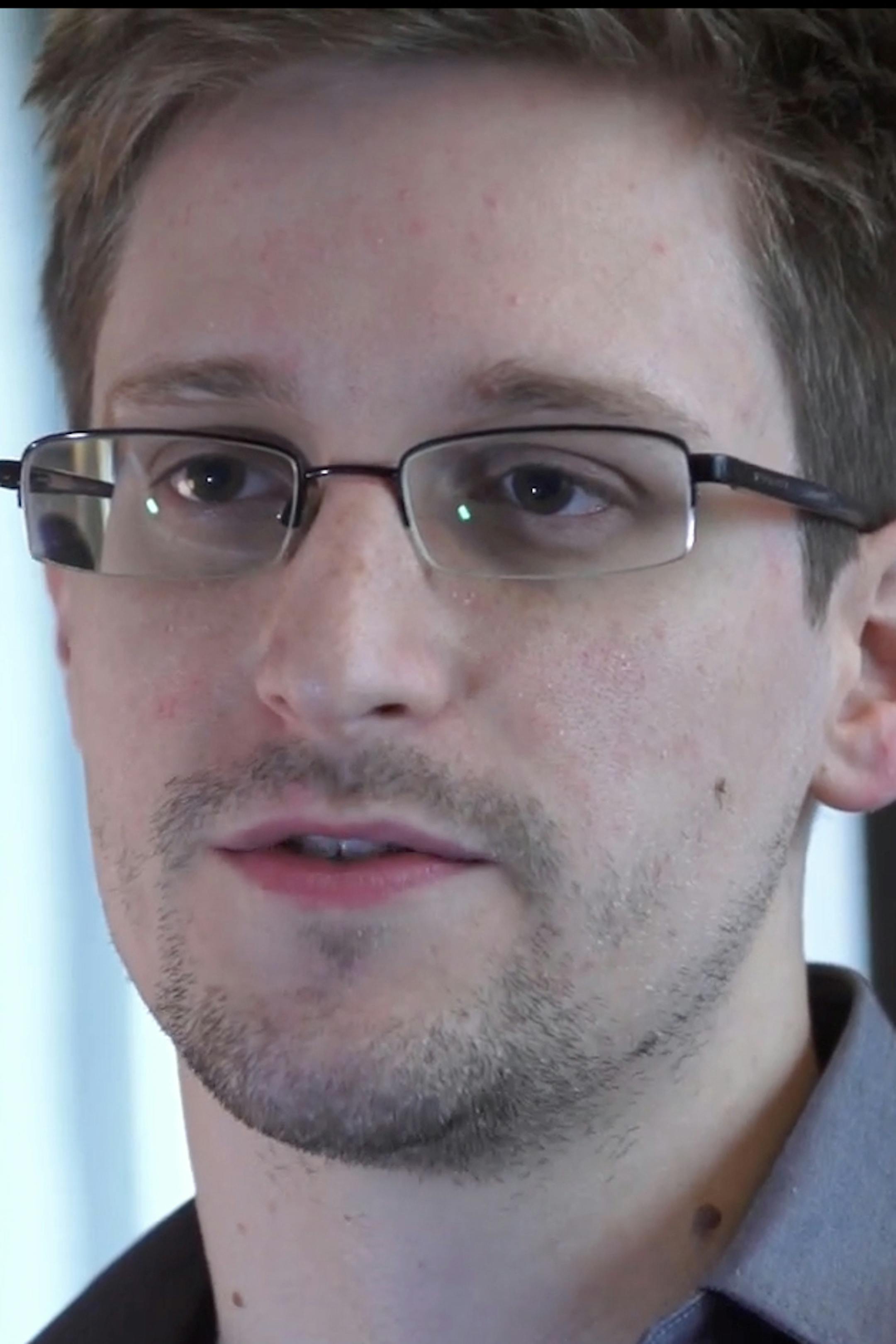 FILE - This Sunday, June 9, 2013 file photo provided by The Guardian Newspaper in London shows Edward Snowden, in Hong Kong. Russian state news agency said Wednesday, July 24, 2013 that US leaker Edward Snowden has been granted a document that allows him to leave the transit zone of a Moscow airport and enter Russia. Snowden has applied for temporary asylum in Rusia last week after his attempts to leave the airport were thwarted. The United States wants him sent home to face prosecution for espi