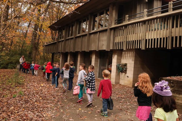 Students walked down a wooded trail between classes at River Grove: Marine Area Community School soon after the charter school opened in 2017.
