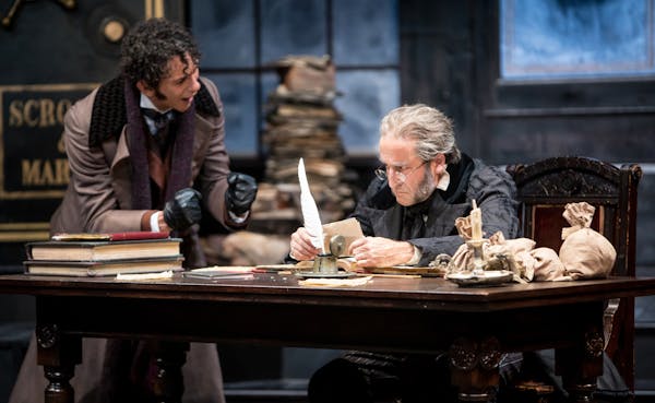 Ryan Colbert (Fred) and J.C. Cutler (Ebenezer Scrooge) in the Guthrie Theater&#xed;s 42nd annual production of the Charles Dickens classic, "A Christm