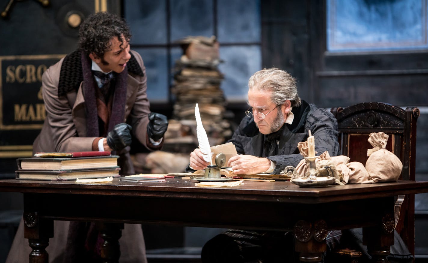 Ryan Colbert (Fred) and J.C. Cutler (Ebenezer Scrooge) in the Guthrie Theater&#xed;s 42nd annual production of the Charles Dickens classic, "A Christmas Carol." Photo by Dan Norman.