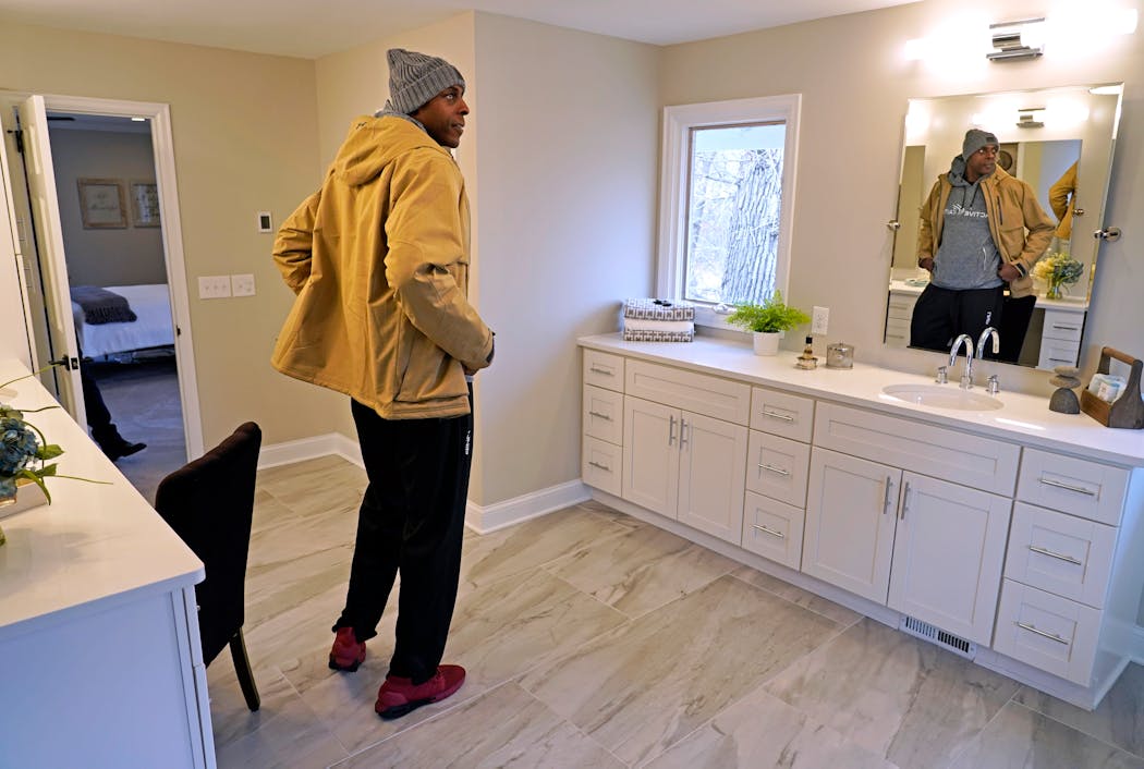 Tolliver loked over a recent remodel of an Orono property.