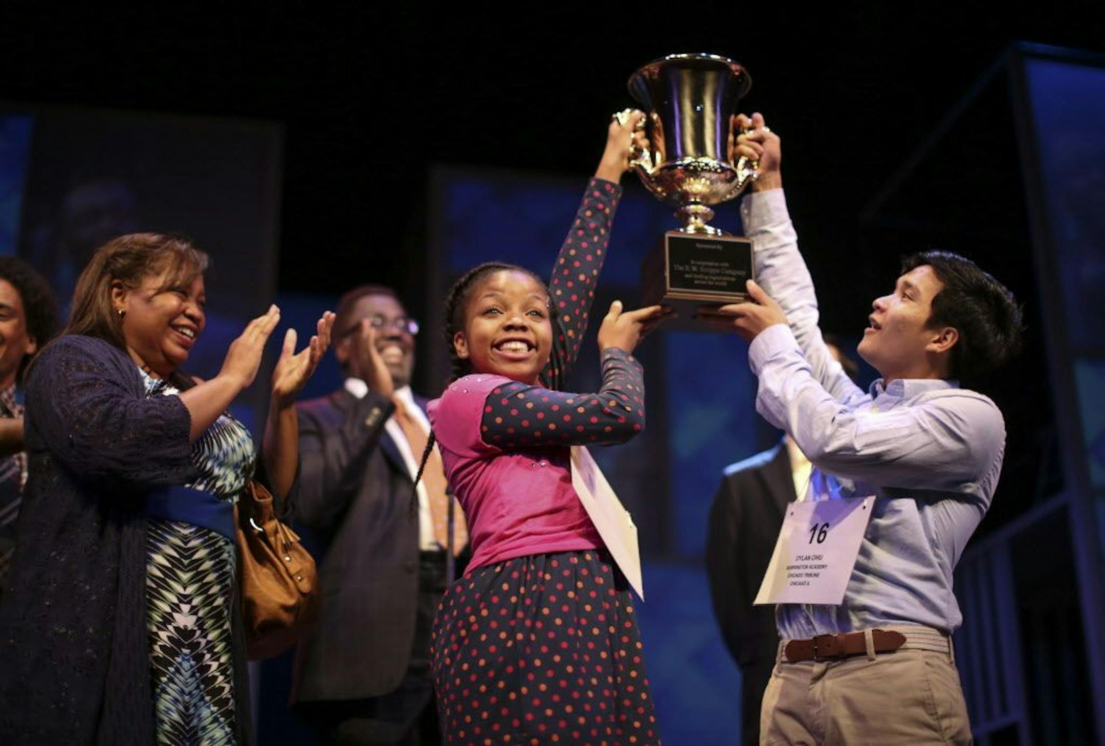 Johannah Easley as Akeelah in a second act scene with Sean Phinney as Dylan and Aimee K. Bryant as her mother, Gail, left, and James A. Williams as her mentor, Dr. Larabee, rear, during rehearsal Sunday night.