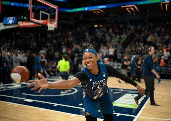 Lynx guard Odyssey Sims tossed a miniature ball to a fan courtside after the Lynx won a game on Sept. 1.