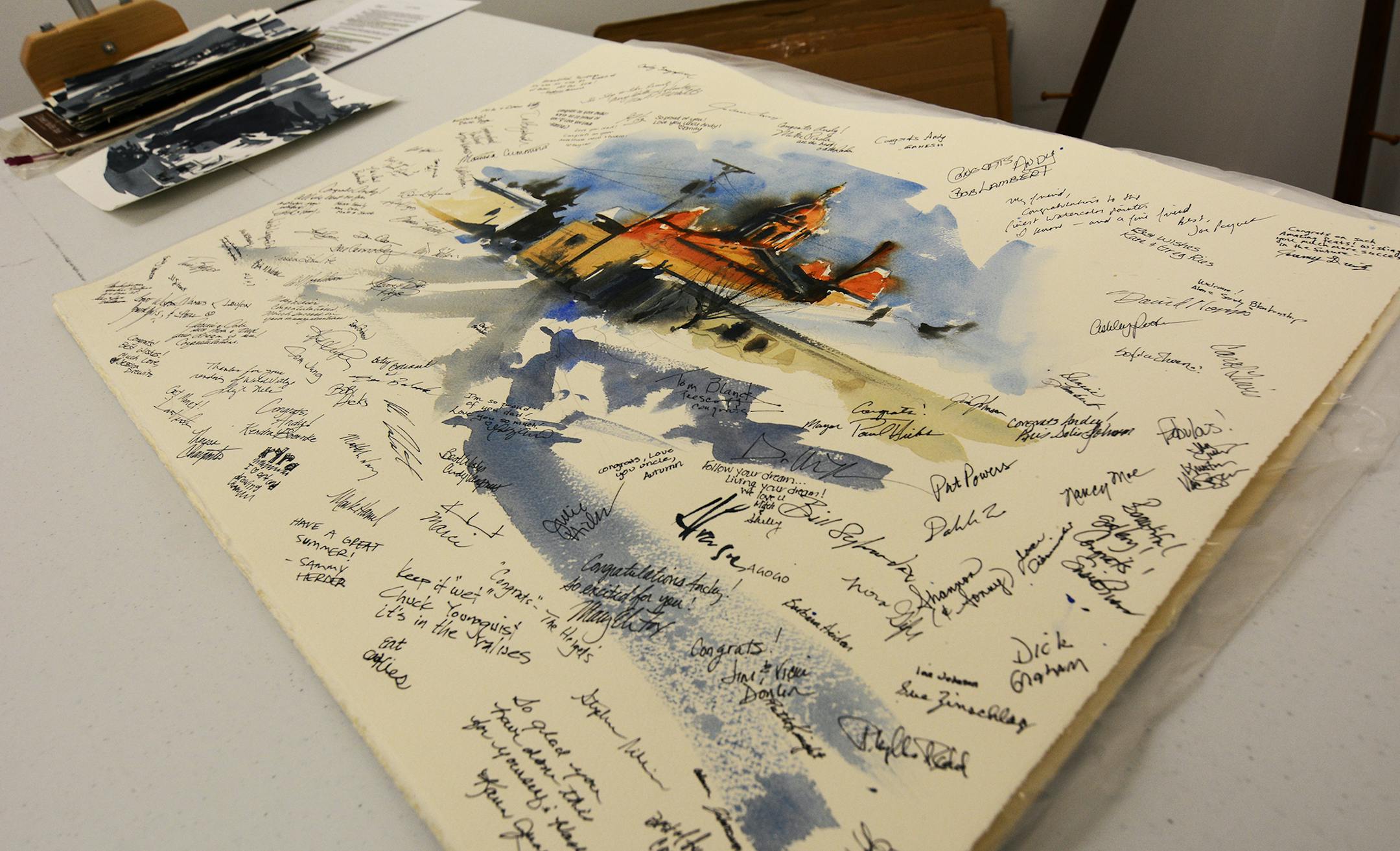 Andy Evansen did this quick sketch of the Hastings City Hall, and guests signed it during the gallery's opening. Photo by Liz Rolfsmeier, Special to the Star Tribune