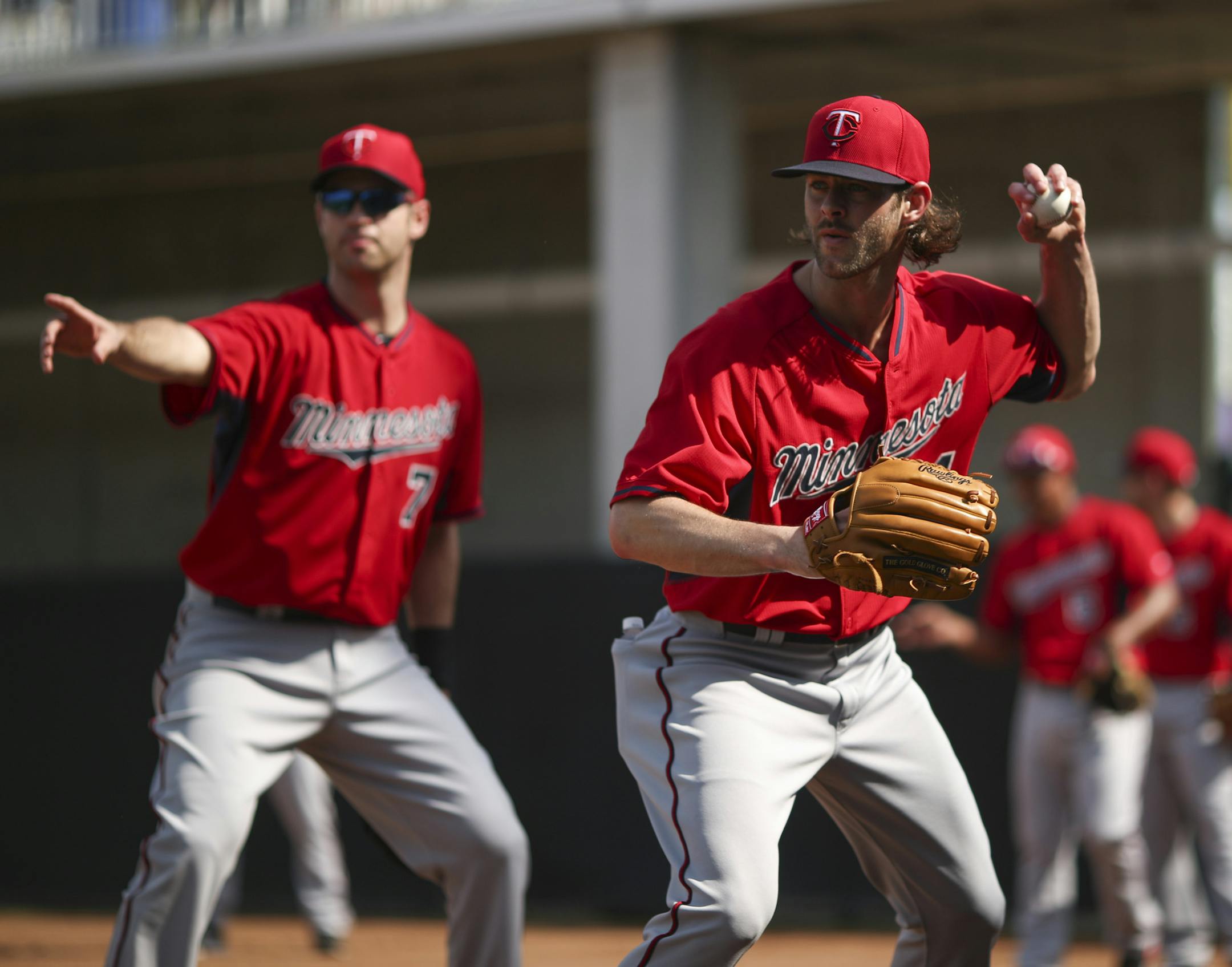 Twins first baseman Joe Mauer (7) had Twins pitcher Aaron Thompson check home after tossing him a ball for a force out at first during practice Saturday morning at Hammond Stadium. ] JEFF WHEELER &#xef; jeff.wheeler@startribune.com Finally, the entire Twins squad worked out at training camp on Saturday, February 28, 2015 in Fort Myers, FL.