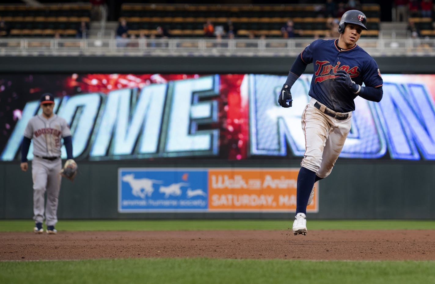 Minnesota Twins Ehire Adrianza rounded the bases after hitting a home run in the third inning.