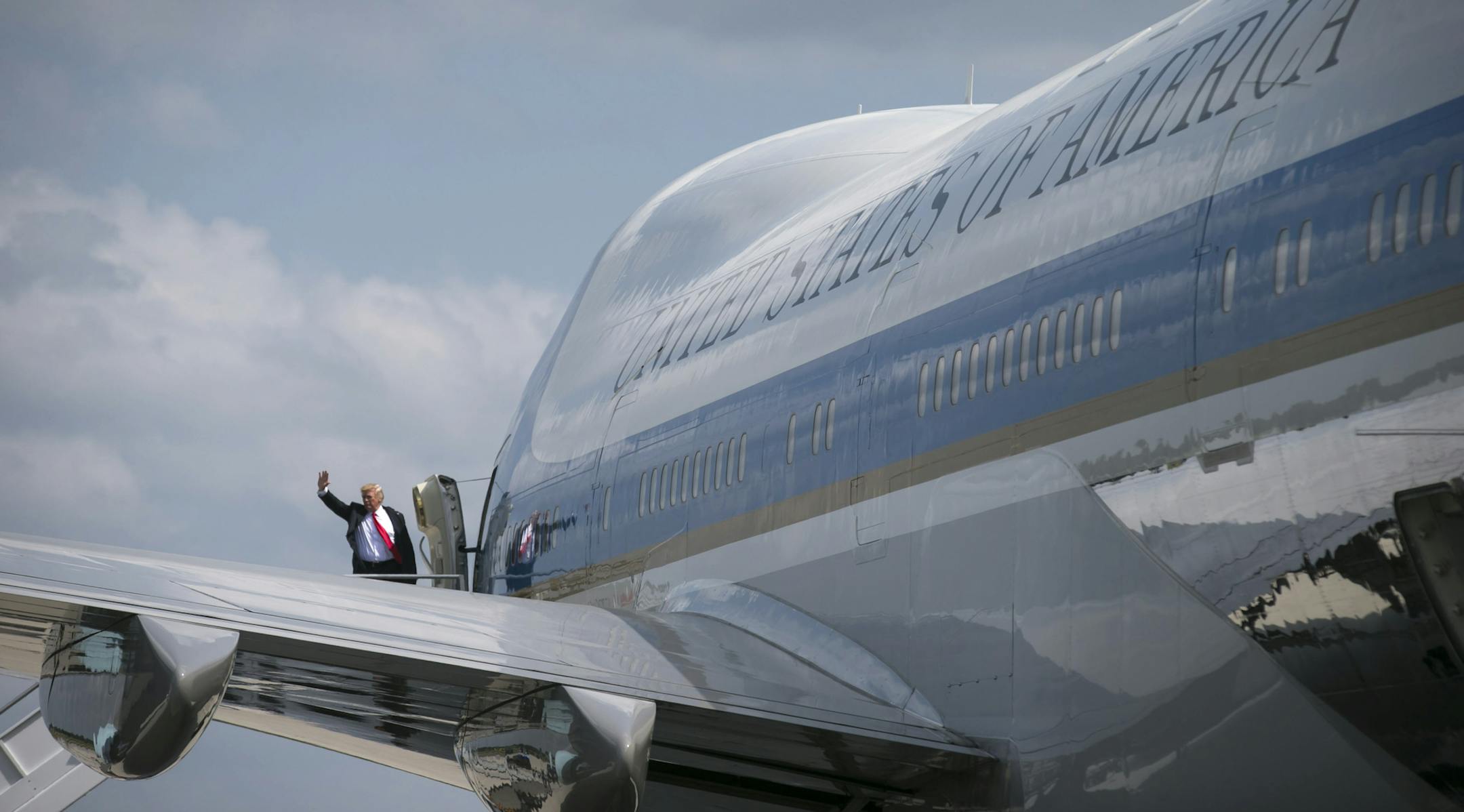 FILE -- President Donald Trump waves as he boards Air Force One in Atlanta, April 28, 2017, a VC-25A (Boeing 747-200B), one of two that presidents dating back to the first George Bush have used for travel. Eight months into Trump’s tenure, several public officials have faced criticism for using military planes and chartered aircraft. Here are some of the fleet of aircraft, flown by the Air Force, that whisks America’s leaders from one corner of the globe to the other. (Al Drago/The
