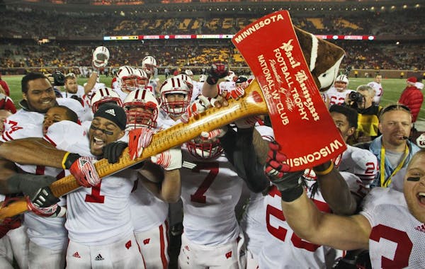 Wisconsin players carried Paul Bunyan's Axe off the field in 2011 after beating Minnesota, which was the last time the teams play at TCF Bank Stadium.