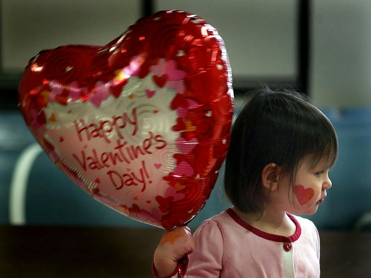 JIM GEHRZ � james.gehrz@startribune.com Minneapolis/February 13, 2009/11:45PM Two-year-old Annie Staloch, Minneapolis, enjoyed a snack during a break in the action at the Love Bub Valentine Party at Longfellow Park in Minneapolis. Annie attended the party with her brother, Nick, 3, and her Dad, Mike. The party offered a variety of activities which included valentine crafts, music, story telling, face painting and snacks.