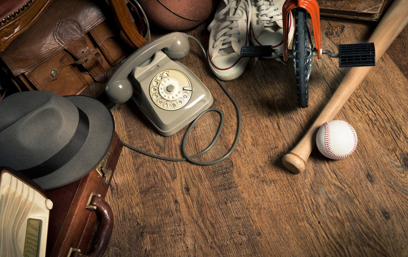 Group of assorted vintage items on hardwood floor at flea market. istock photo