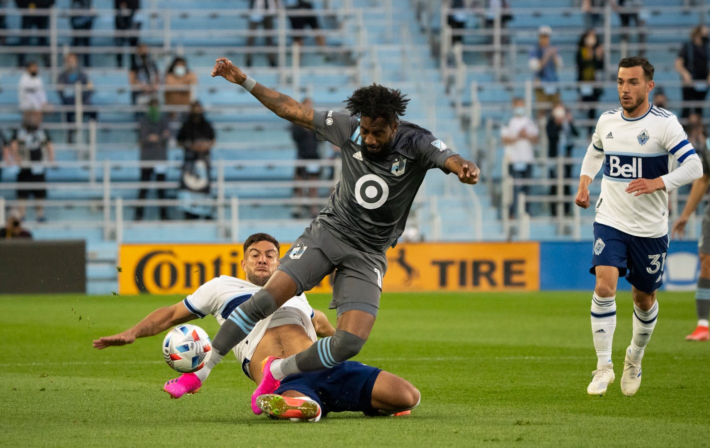 Vancouver Whitecaps forward Lucas Cavallini (9) tried to put Minnesota United defender Romain Metanire (19) off the ball in the first half. ] JEFF WHEELER • jeff.wheeler@startribune.com