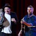 Musicians Marcus Mumford, left, and Oscar Isaac perform together during "Another Day, Another Time: Celebrating the Music of Inside Llewyn Davis" at T