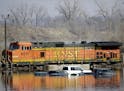 Cars sat Sunday in floodwaters from the Platte River alongside a BNSF train in Plattsmouth, Neb. Hundreds of Nebraskans remained out of their homes.