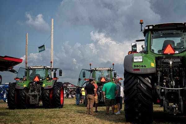 FarmFest attendees looked over the latest in heavy farm equipment at Ziegler Ag on Aug. 2 in Redwood Falls, Minn.
