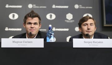 Chess world champion Magnus Carlsen, of Norway, left, and his challenger, Sergey Karjakin, of Russia, participate in a news conference to promote the 