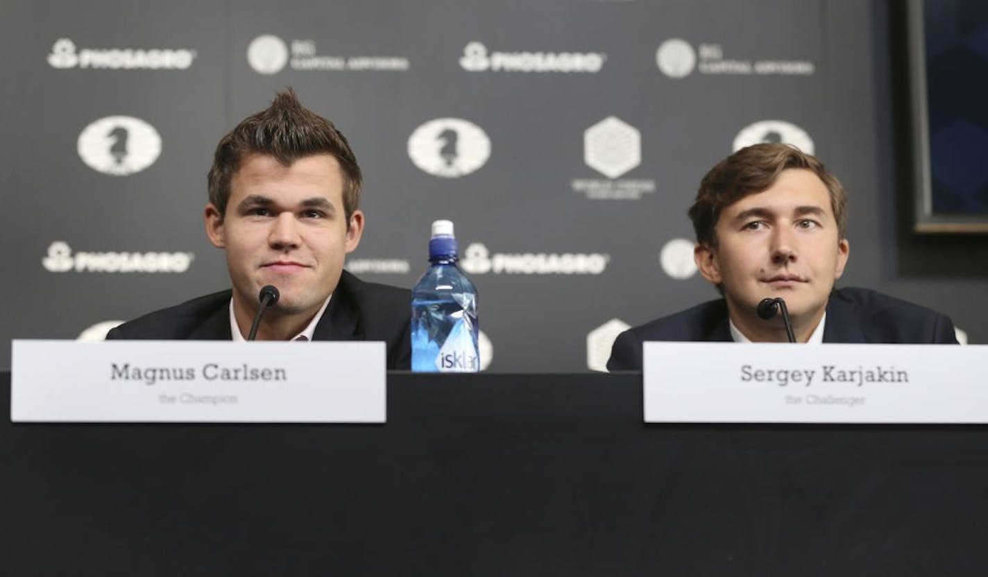 Chess world champion Magnus Carlsen, of Norway, left, and his challenger, Sergey Karjakin, of Russia, participate in a news conference to promote the World Chess Championship in New York, Thursday, Nov. 10, 2016. The championship returns to New York after 21 years and runs until Nov. 30, 2016.