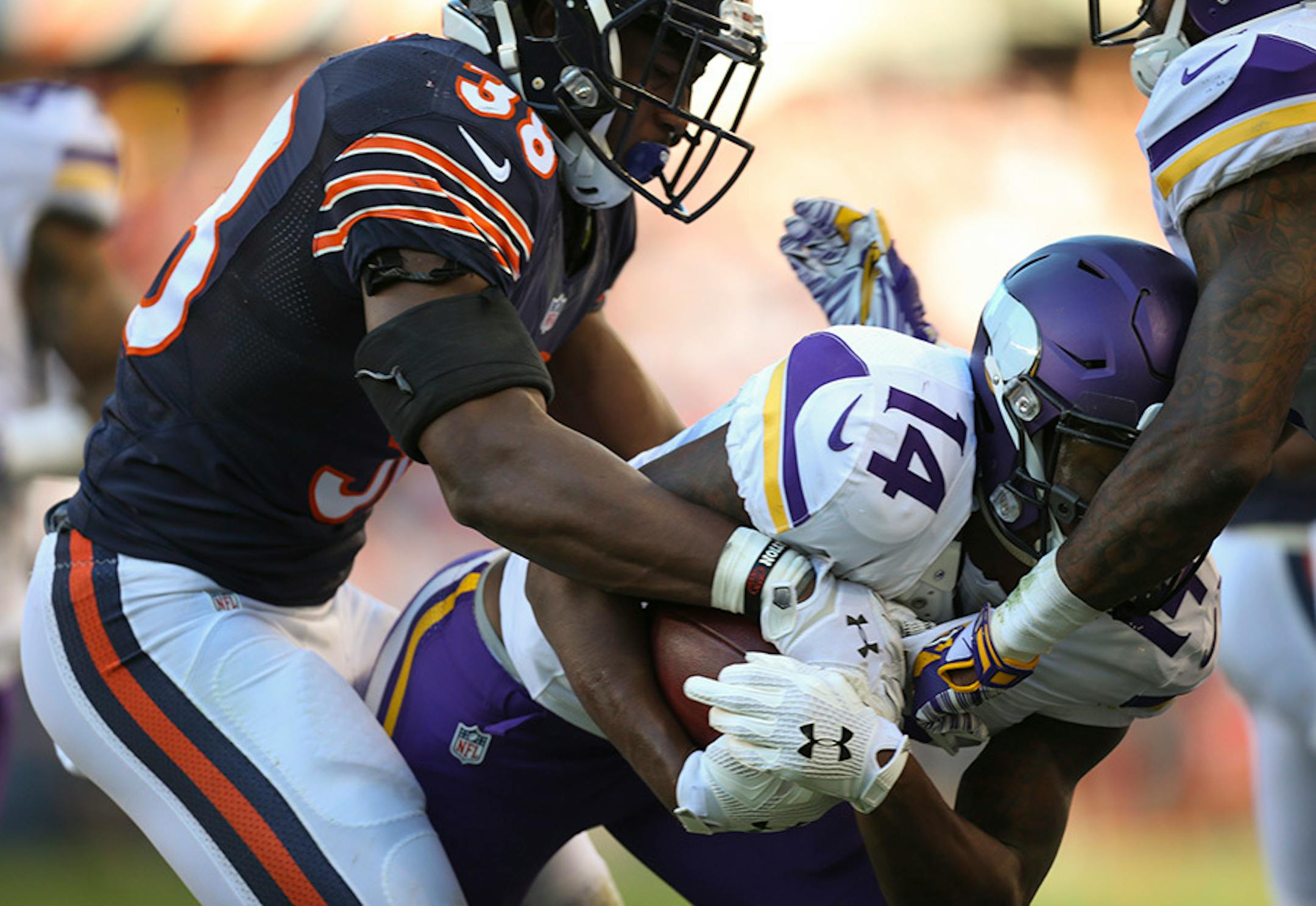 Vikings wide receiver Stefon Diggs (14) held onto the ball as he fell into the endzone with a 40 yard reception in the fourth quarter Sunday afternoon. Bears free safety Adrian Amos (38) was attempting to strip it from the left.