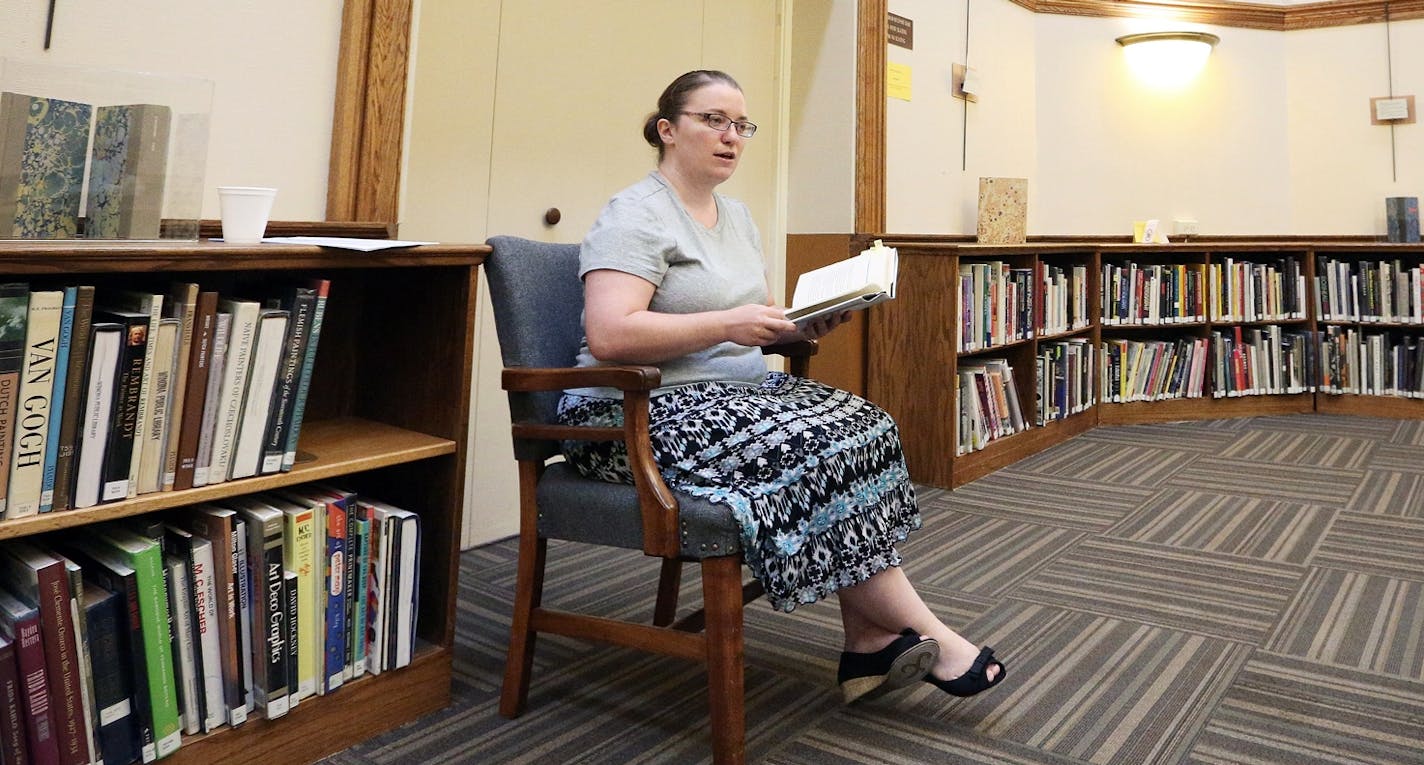 Samantha TerBeest, an Adult Services Librarian reads a short story from B.J. Novak's "One More Thing: Stories and Other Stories" in Winona, Minn. The Winona Public Library held its first adult story time session on Sept. 2, a new program that invites adults to bring a lunch, relax and listen to short stories for a half-hour. Librarian Samantha TerBeest said the event is "the new thing" among bigger libraries in the country. (Rory O'Driscoll/The Winona Daily News via AP) MANDATORY CREDIT ORG XMIT