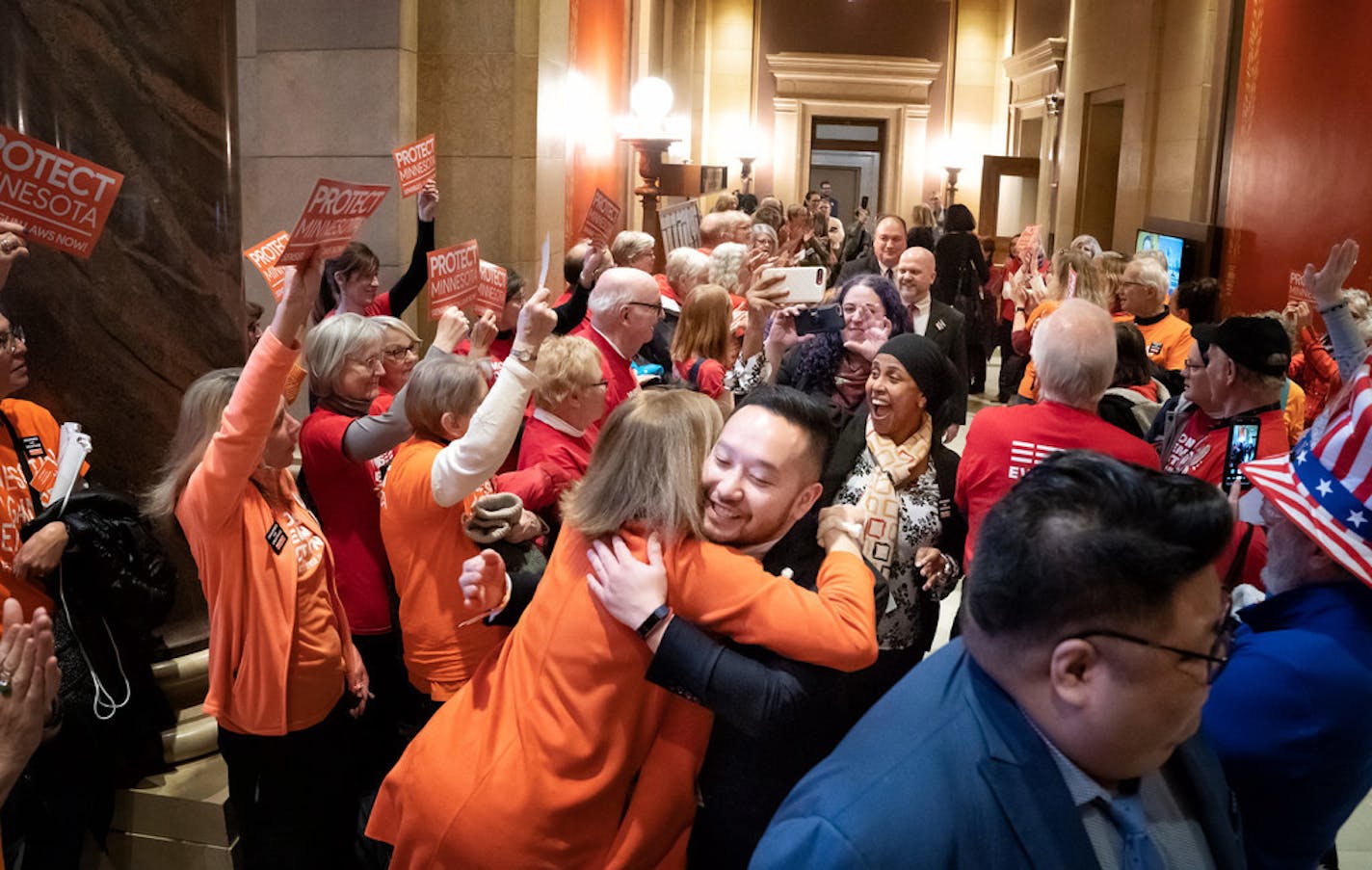 Gun safety advocates from Protect Minnesota and Moms Demand Action chanted and cheered on DFL legislators who plan to vote for bills today that would expand background checks and a new red flag law.