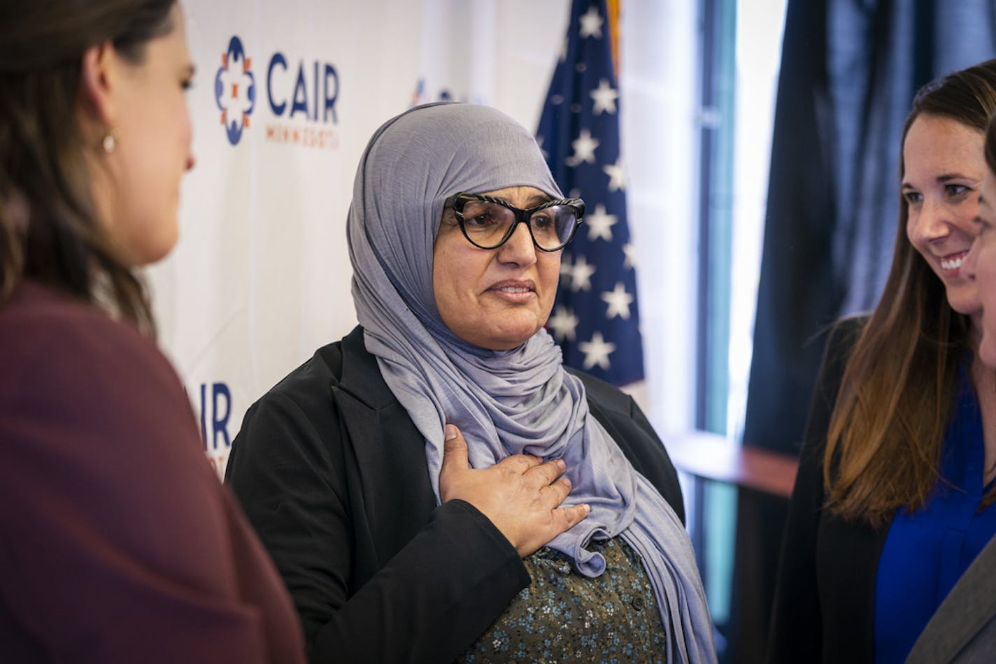 Aida Shyef Al-Kadi spoke with her lawyers Virginia McCalmont, left, and Caitlinrose Fisher of Green Espel after Tuesday's news conference. ] LEILA NAVIDI &#x2022; leila.navidi@startribune.com