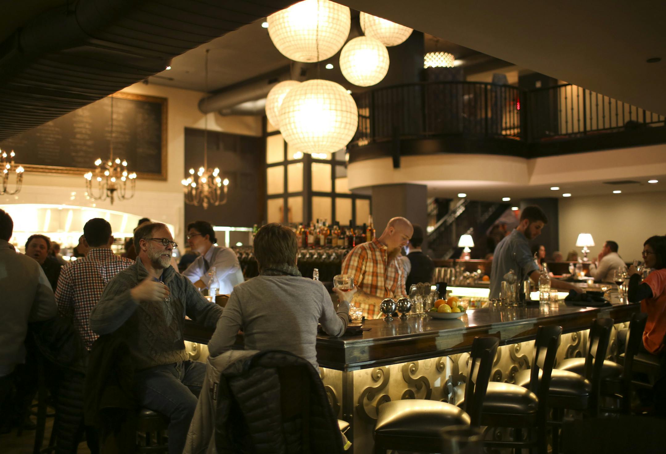 The owners of Borough and Parlour have invaded Uptown with coup d'&#x221a;&#xa9;tat, a big new bar/restaurant on the street level of a new apartment tower on Lagoon in the heart of Uptown. Patrons seated at the bar as coup d'&#x221a;&#xa9;tat had their soft opening Monday night, January 13, 2013. ] JEFF WHEELER &#x201a;&#xc4;&#xa2; jeff.wheeler@startribune.com