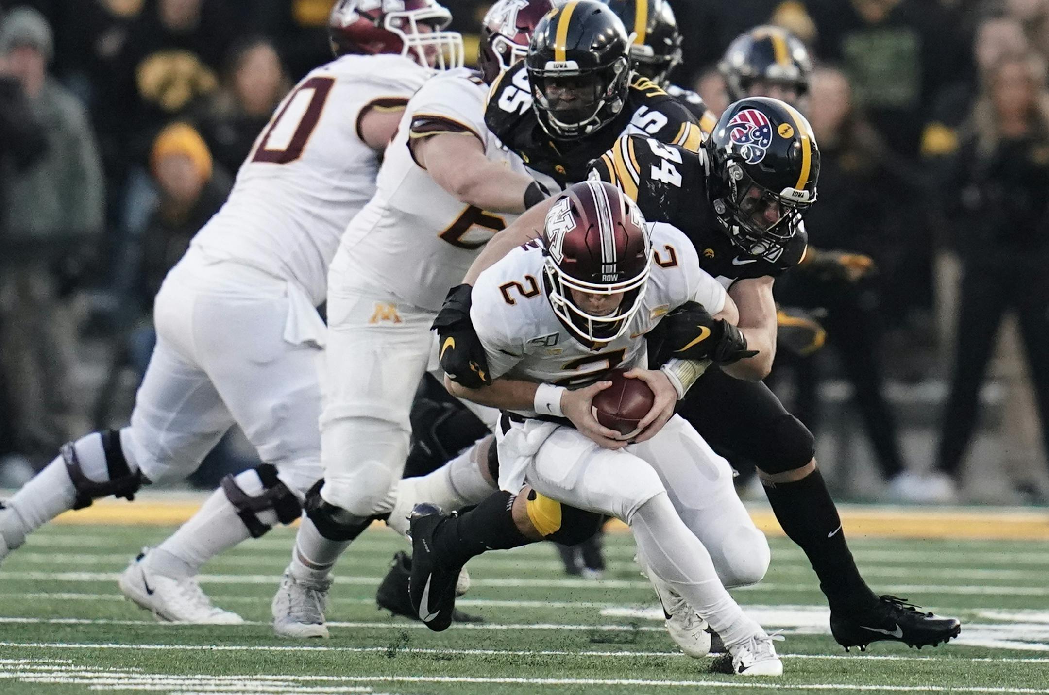 Minnesota Gophers quarterback Tanner Morgan (2) was sacked late in the second quarter by Iowa Hawkeyes linebacker Kristian Welch (34). ] MARK VANCLEAVE ¥ The Minnesota Gophers played the Iowa Hawkeyes at Kinnick Stadium on 16, 2019 in Iowa City.