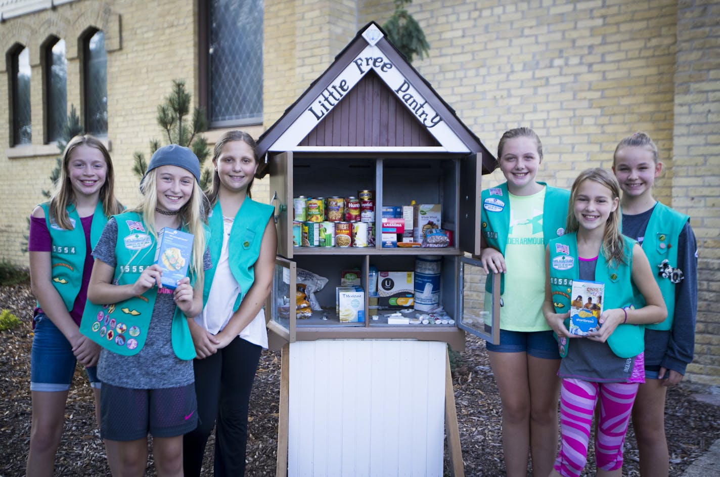 Girl scouts from the left; Vanessa Fasching, Justine Meyers, Jenna Peterson, Sydney Boeckers, Zoey Myers, and Reagan Gamades have created a free little pantry in downtown Chaska, Minn. photographed on Tuesday, August 29, 2017. ] RENEE JONES SCHNEIDER &#x2022; renee.jones@startribune.com