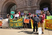 A group urging the Minneapolis City Council to support former tenants of embattled landlord Stephen Frenz rallied in front of Minneapolis City Hall af