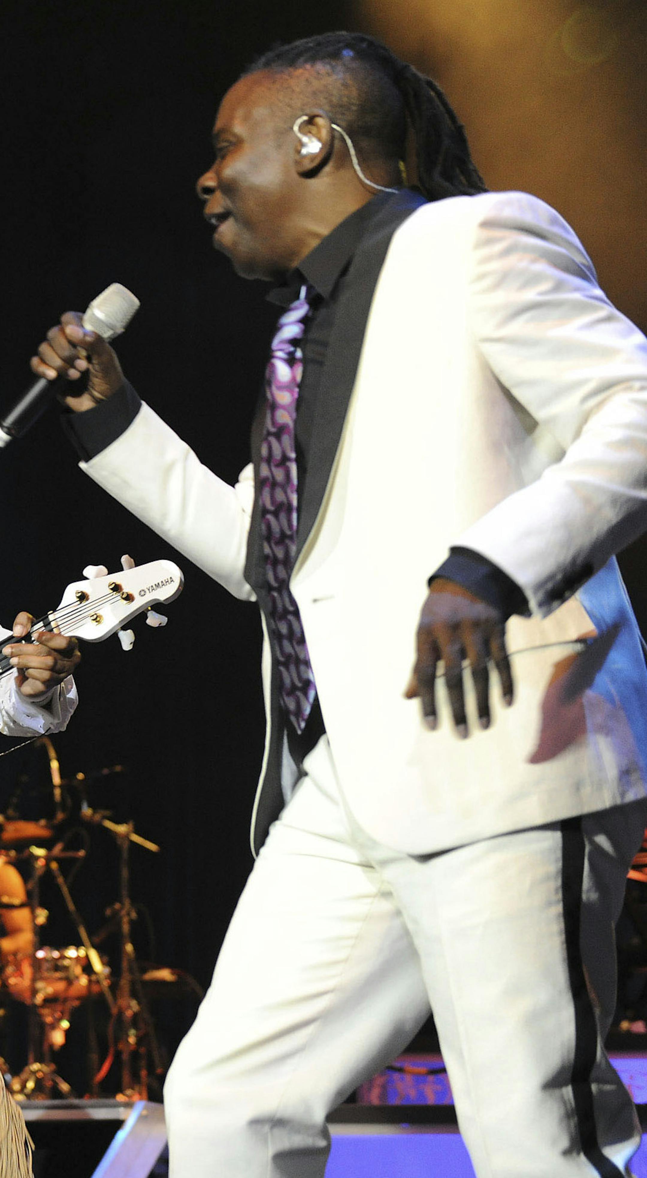 American musicians Maurice White, Verdine White and Philip Bailey of Earth Wind and Fire, on stage at the O2 Arena in London, Thursday, July 22, 2010. (AP Photo /Mark Allan)