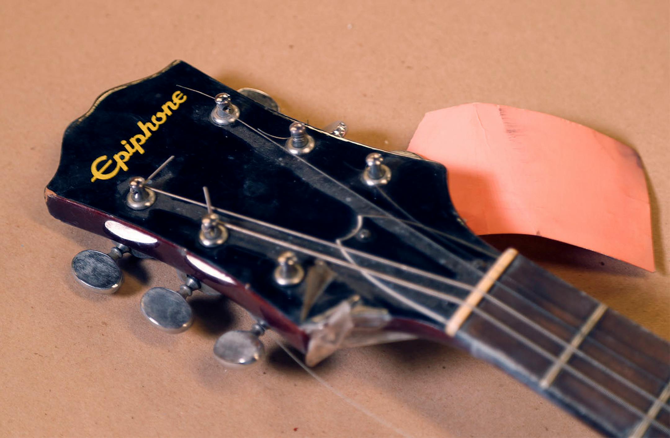 Members of the Minneapolis Cold Case Squad Sgt. Chris Karkostas left, and Sgt. Jane Moore talked about the unsolved murder of Joseph Behrend at the police department�s evidence warehouse Monday August 15, 2016 in Minneapolis, MN. The red Epiphone guitar is believed to be the murder weapon.