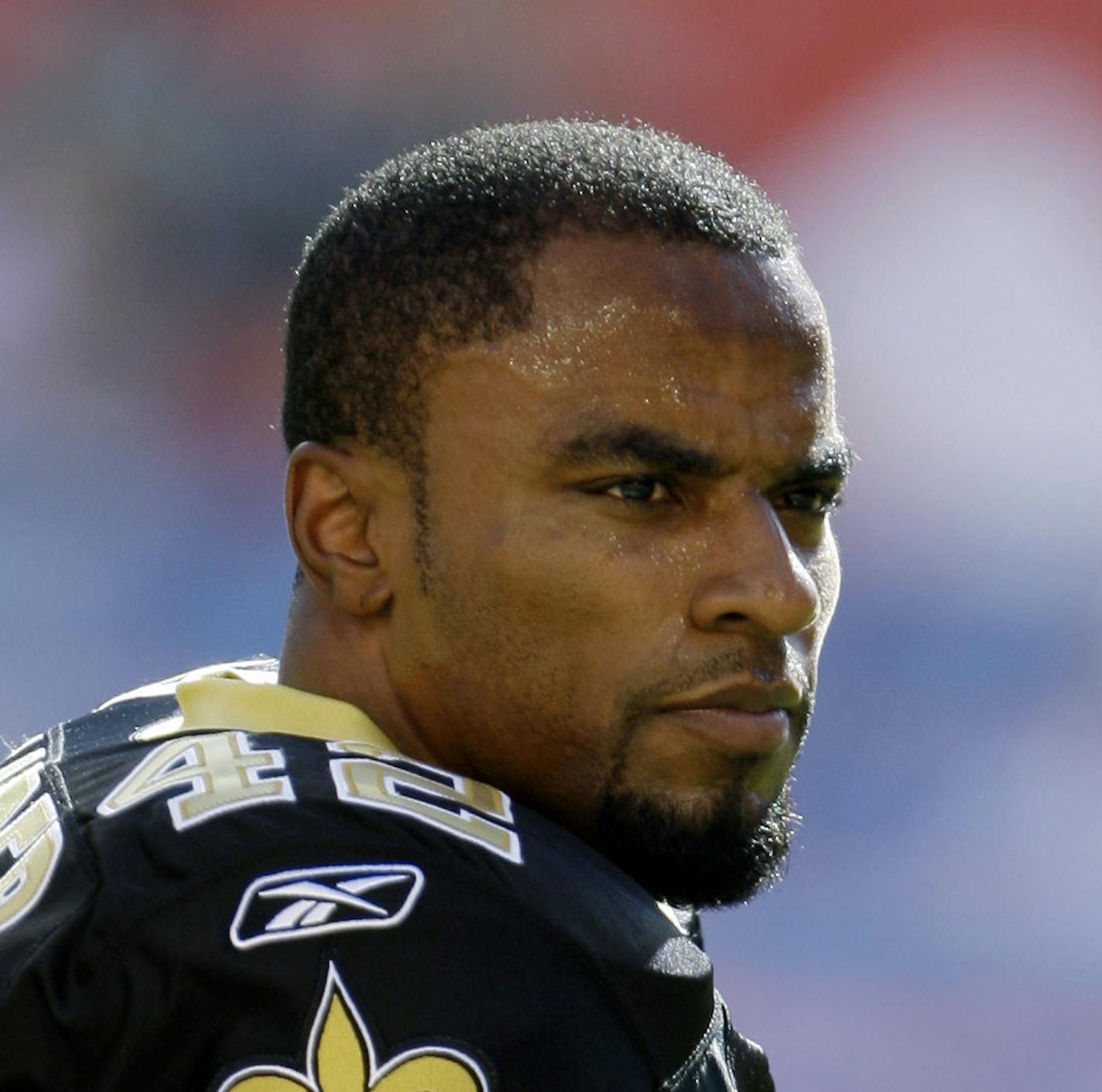 FILE - In this Oct. 25, 2009, file photo, New Orleans Saints safety Darren Sharper looks on during warm-ups before an NFL football game against the Miami Dolphins in Miami. The former NFL star defensive back has been arrested on suspicion of rape, the Los Angeles Police Department said. Sharper was arrested and booked Friday, Jan. 17, 2014, and released on $200,000 bail just before midnight, according to the LAPD. He faces a Feb. 14 court appearance. (AP Photo/Lynne Sladky, File)