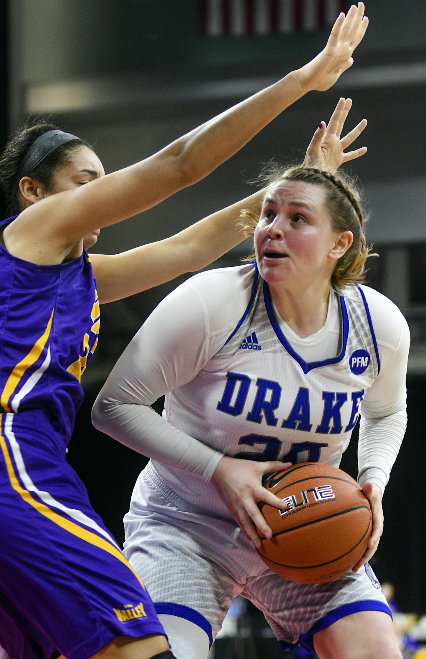 Drake's Maddy Dean (20) looks for a shot over Northern Iowa's Mikaela Morgan (24) during an NCAA college basketball game in the Missouri Valley Conference championship Sunday, March 11, 2018, in Moline, Ill. (Meg McLaughlin/The Rock Island Argus via AP)