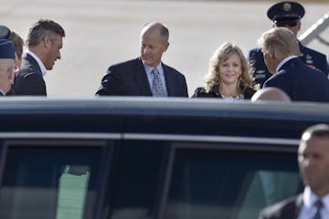 Supporters, including Republican Senate Majority Leader Paul Gazelka, left, and his wife Maralee, meet President Donald Trump as he arrived at Minneap