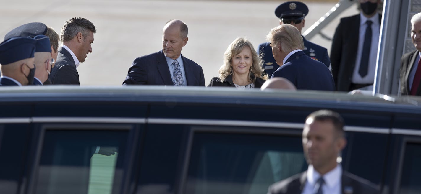 Supporters, including Republican Senate Majority Leader Paul Gazelka, left, and his wife Maralee, meet President Donald Trump as he arrived at Minneapolis-St. Paul International Airport on Sept. 30.