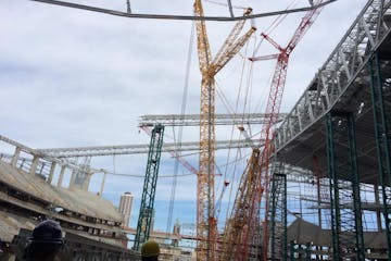 Beneath the forest of cranes, the new Vikings stadium is taking shape.