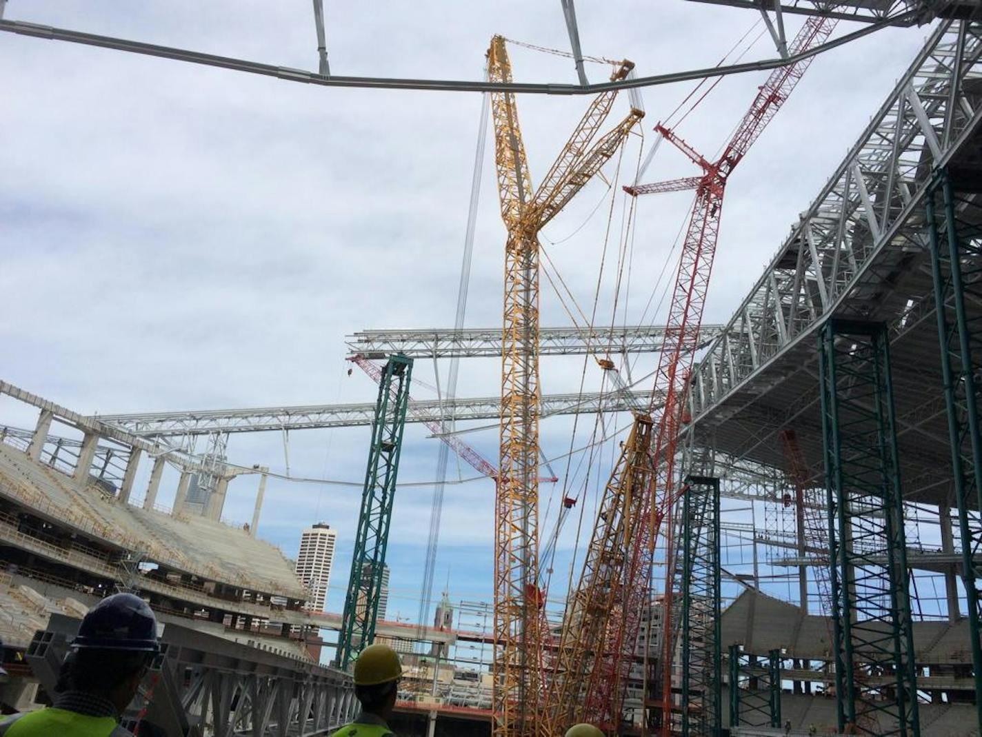 Beneath the forest of cranes, the new Vikings stadium is taking shape.