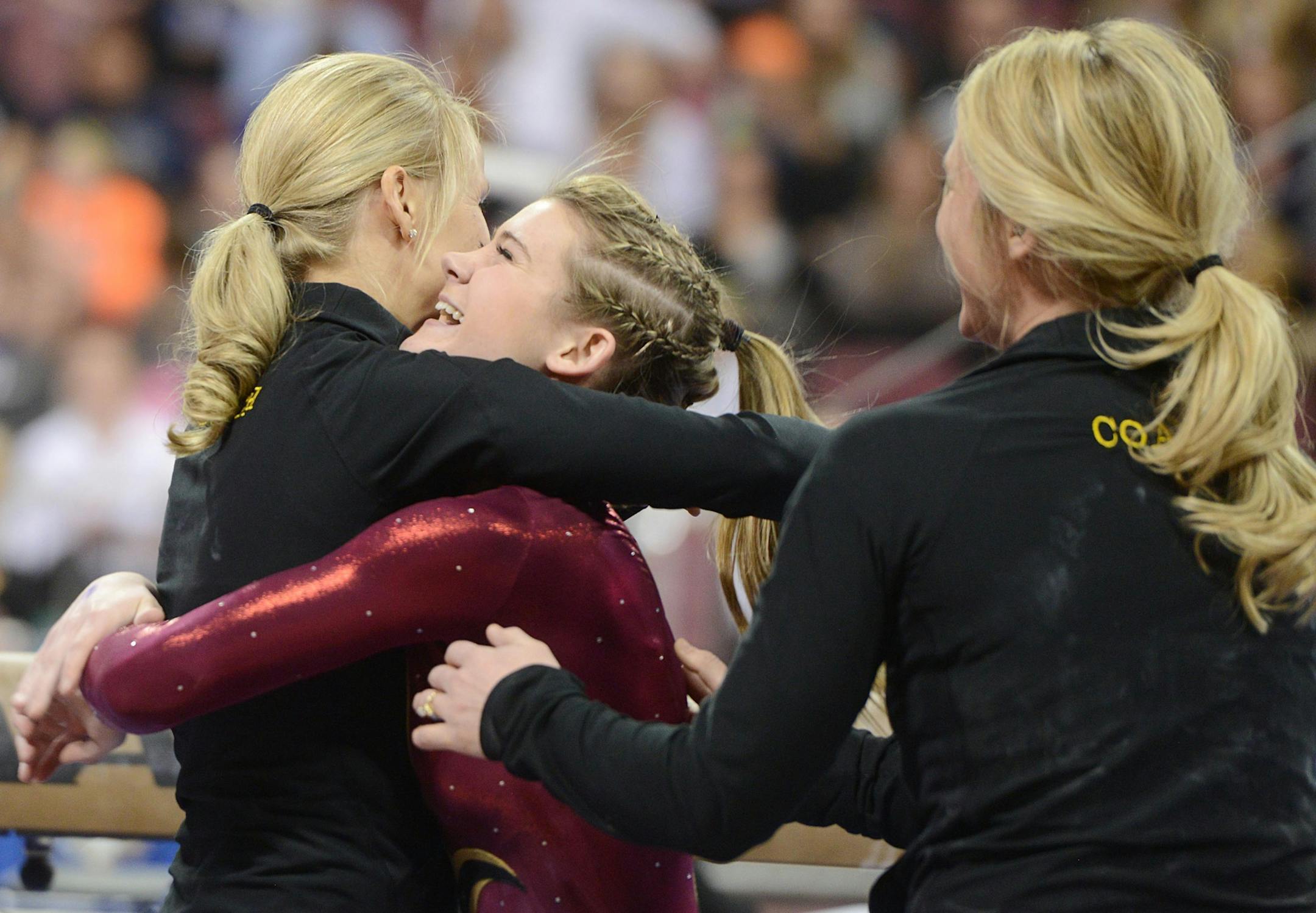 Northfield&#x2019;s Bailey DuPay hugged her coaches after her performance on balance beam. (Bridget Bennett, Star Tribune)