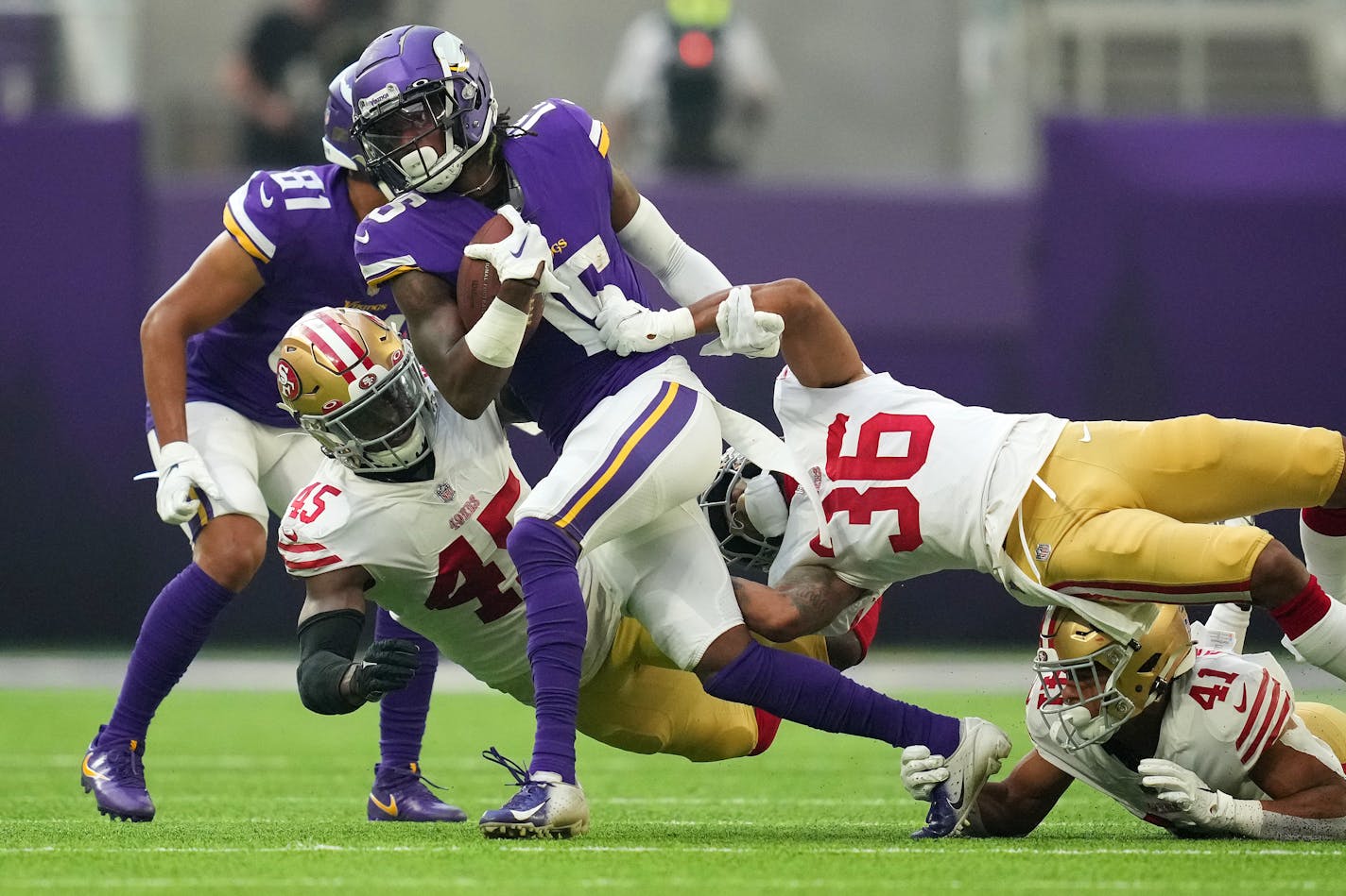 Vikings wide receiver Ihmir Smith-Marsette is brought down by San Francisco cornerback Tariq Castro-Fields in the second quarter of a Saturday's preseason game.