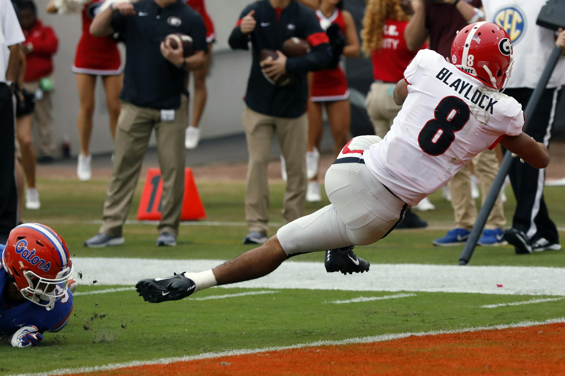 Georgia wide receiver Dominick Blaylock (8) drives in for a touchdown in the first half of a NCAA college football game against Florida, Saturday, Nov. 2, 2019, in Jacksonville, Fla. (Joshua L. Jones/Athens Banner-Herald via AP)